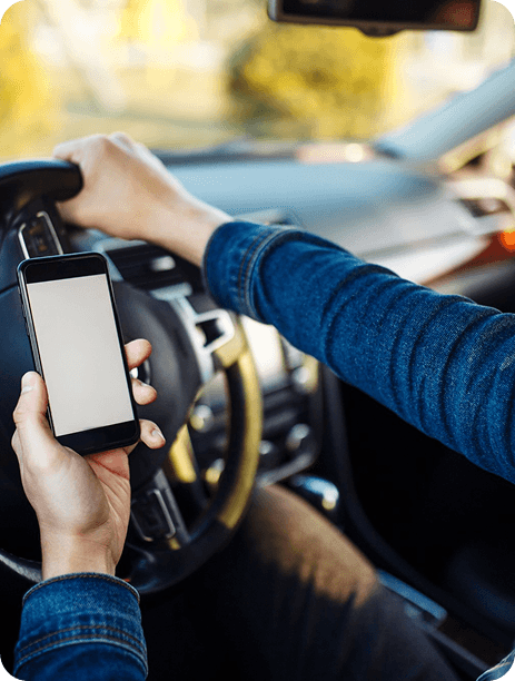 Driver holding phone while driving
